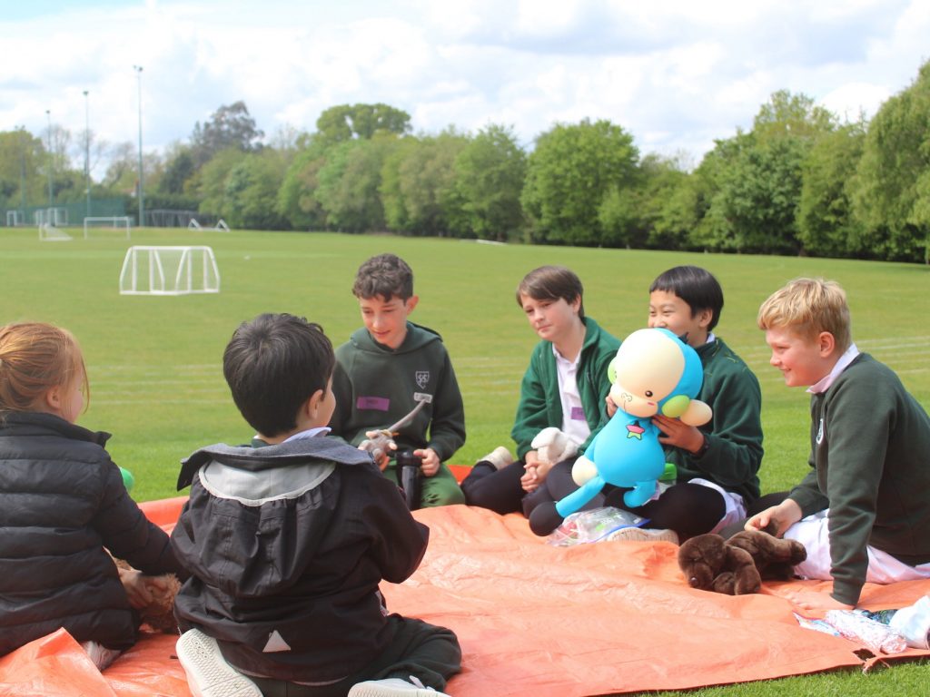 Boys having a chat outside on a field
